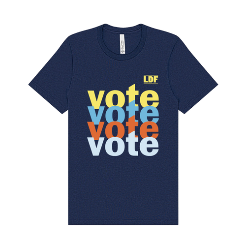A navy blue short-sleeve t-shirt with a stacked 'vote' graphic in yellow, light blue, orange, and white on the front, plus a small yellow 'LDF' logo in the upper right of the print.