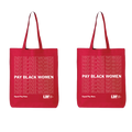 Two red reusable tote bags shown side by side on a plain white background. Each bag has long handles, a repeating light pink 'PAY BLACK WOMEN' text pattern, and bold white text reading 'PAY BLACK WOMEN' with smaller white text 'Equal Pay Now.